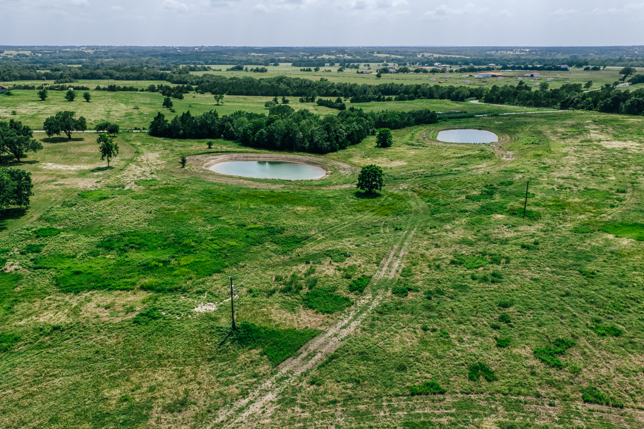 Aerial of The Clearing — multiple ponds and open land