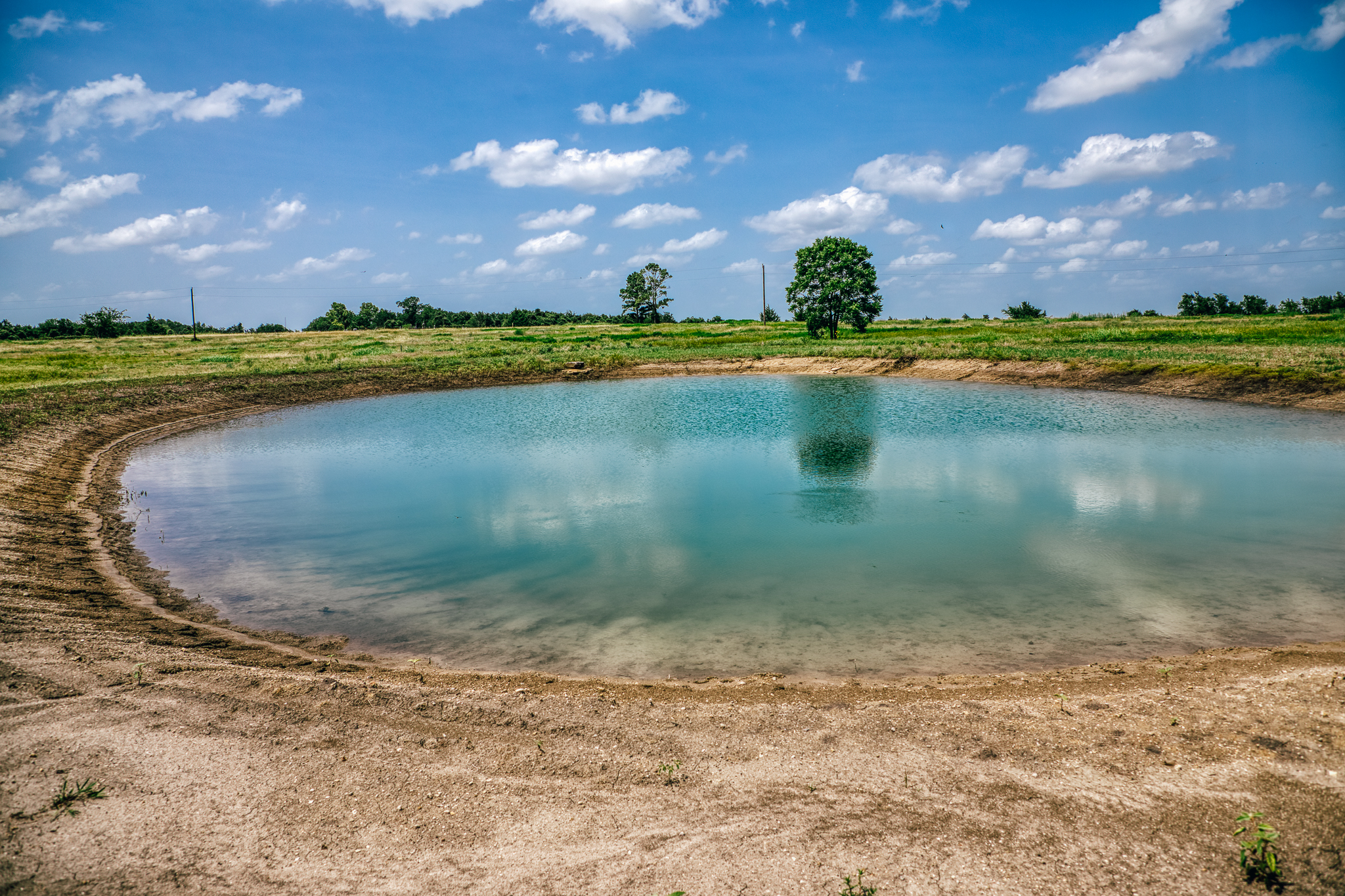 Pond with reflections under blue sky — Lot 2