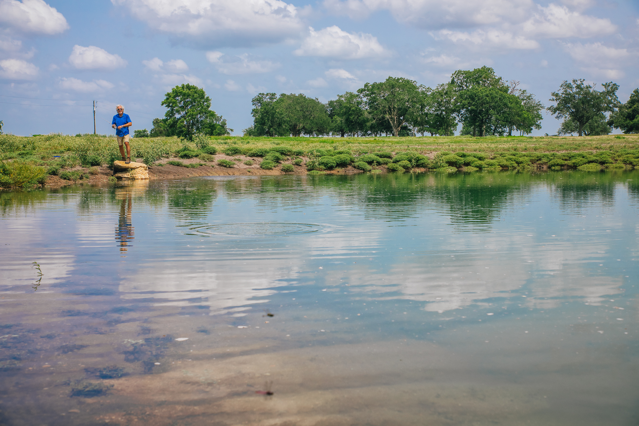 Fishing from the pond bank — Lot 1, The Clearing